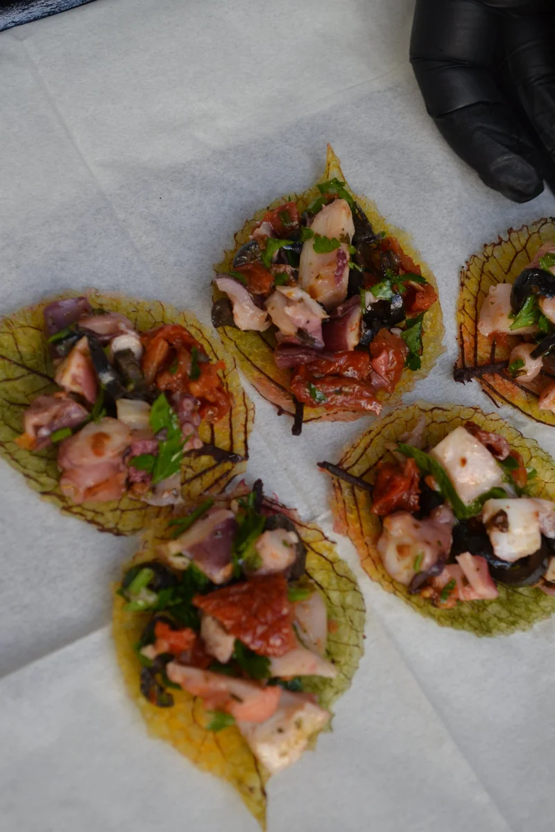Octopus and sun-dried tomato bites served on the METRO stand